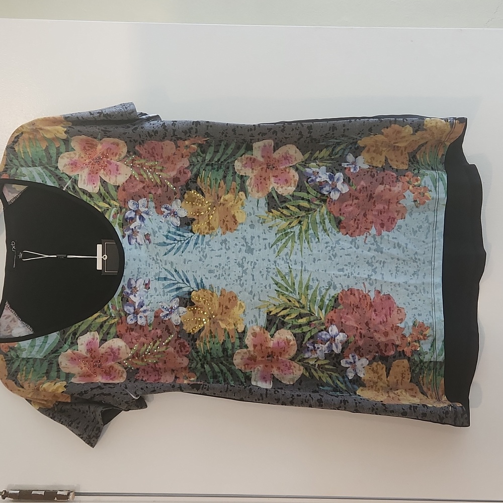 Ladies cap sleeve floral print on front, solid black back. Size Lg by rxb.